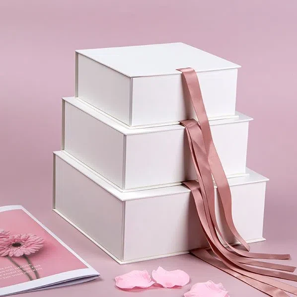 White Folded Box With Pink Ribbon